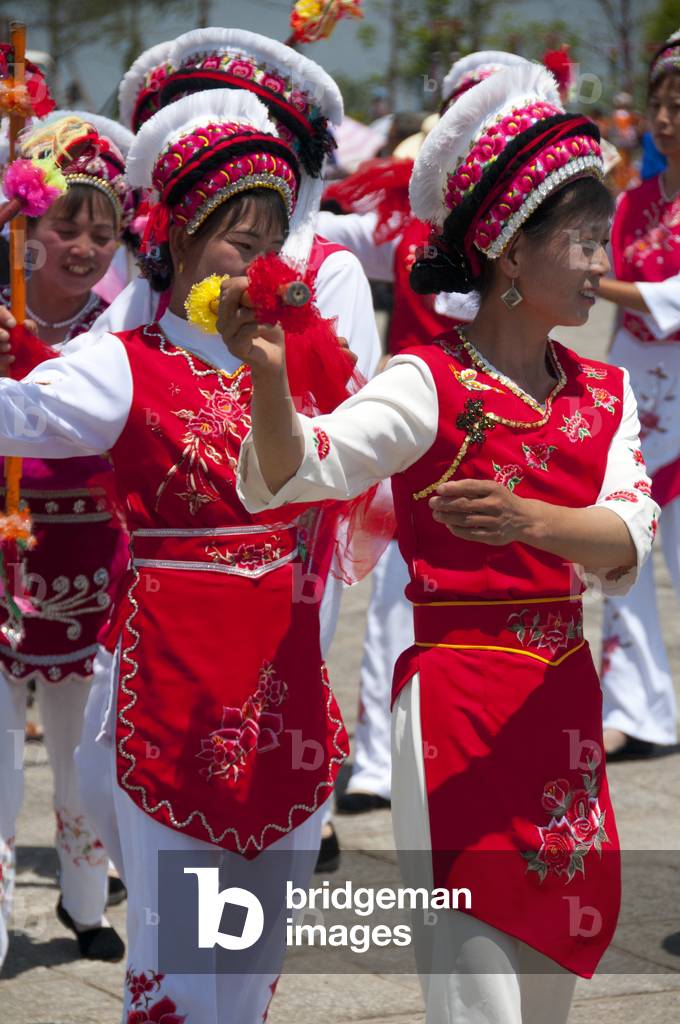 China: Bai women dancing at the Bai music and dance festival at Santa Si (Three Pagodas), Dali, Yunnan