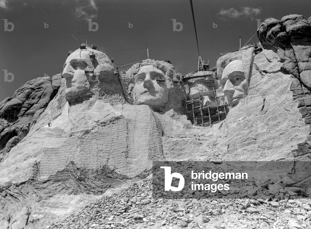 Mount Rushmore National Memorial being carved by stoneworkers, the massive sculptur..., 1935 (photo)
