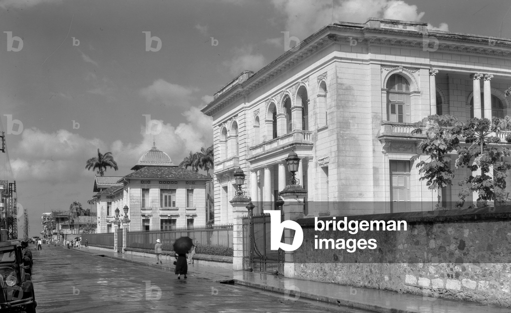 Colonial mansion houses and stone walls line street, British West Indies., 1940 (photo)