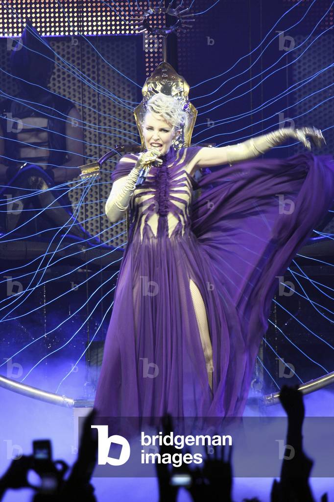 kylie minogue purple dress Kylie Minogue performed in her TENSION TOUR yesterday (June 2) in London on  her third night, and with changes like the new purple look for Act I, she  sang 'Speakerphone' and 'Hand