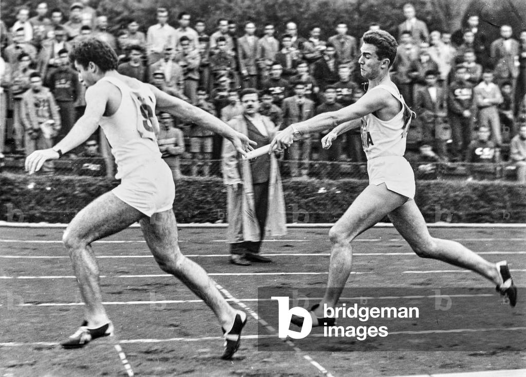 Image of Relay racers, passing off the baton by Unknown photographer ...