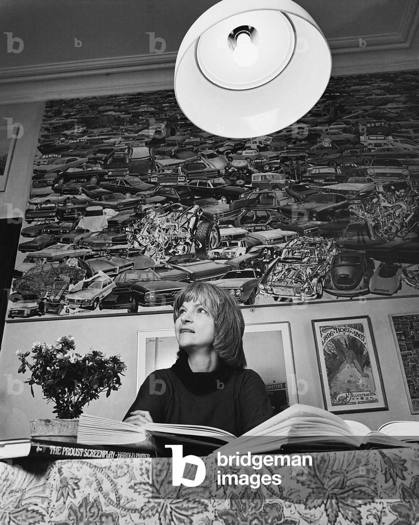 Image of Photography depicting Alison Lurie with large lamp 1978 by Mayotte Magnus
