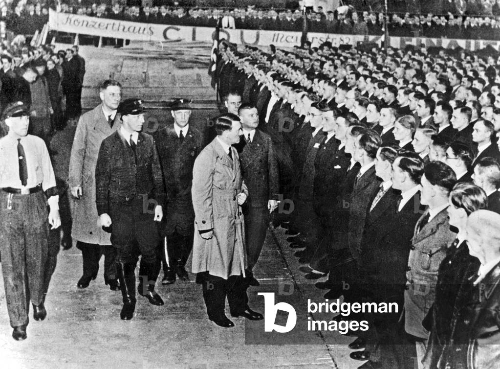 Adolf Hitler with nazi personnalities among them Ernst Roehm (behind him on r) during review of his supporters