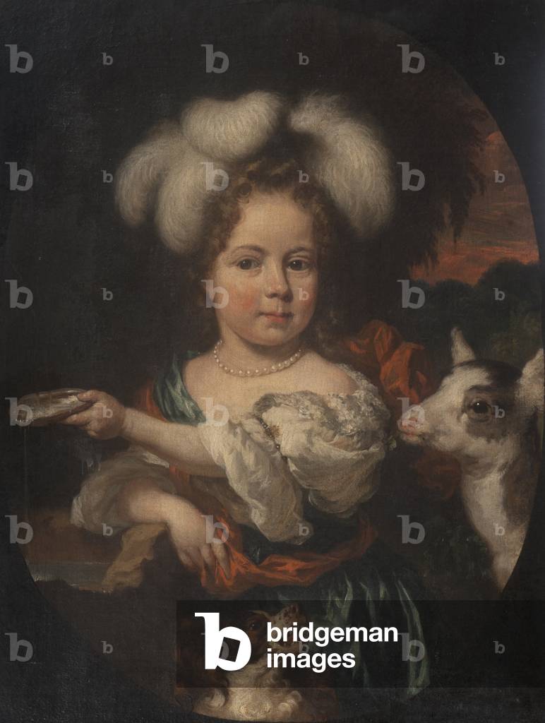 Ein junges Mädchen in einer Feder Headdress mit einem Kind