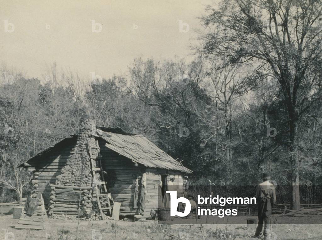 Three African Americans outside a cabin, possibly Mt. Meigs, Alabama 1890 (photo)
