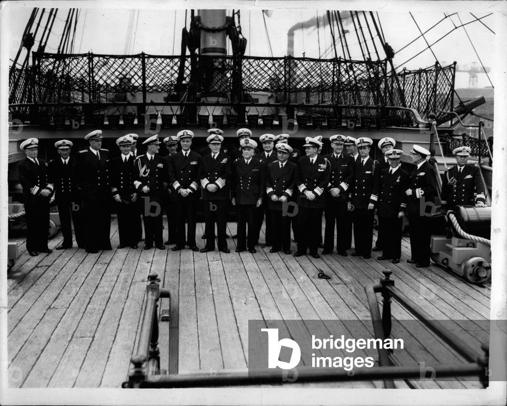 Jun 06, 1953 - Fleet Review Guests Visit H.M.S Victory At Portsmouth. Officers Aboard H.M.S. Victory.. Officers form the visiting warships now assembled off Portsmouth for next week's Fleet Review by H.M. The Queen - were invited aboard H.M.S. Victory for lunch this afternoon. Keystone Photo Shows: - Group of visiting officers aboard the Victory today.. They are L-R: Rear Admiral G.W.G. Simpson, Flag Officer Subs; Captain O.I. Rudakov of Russia; Commander C.O. Herlofsen (Norway); Captain G.A.B. de Mark (Sweden); Vice Admiral J.Wright (USA); Admiral Sir John Edelsten (C. in C. Portsmouth); Vice Admiral Gastone Minotti (Italy); Vice Admiral (Italy); Vice Admiral N. Mariane (France) Rear Admiral Tacettin Talayman (Turkey) Vice-President Admiral P. Lappas; Captain C.W.T. Baron von Boetzelaer (Holland); Commander Rafael B. Richardson Lightbourne (Dominican Republic); Rear Admiral Don Pedro Niet Antunez (Spain); Captain F.Q.N. Dias (Portugal); and Commander Luang Charn Chayasak (Thailand)