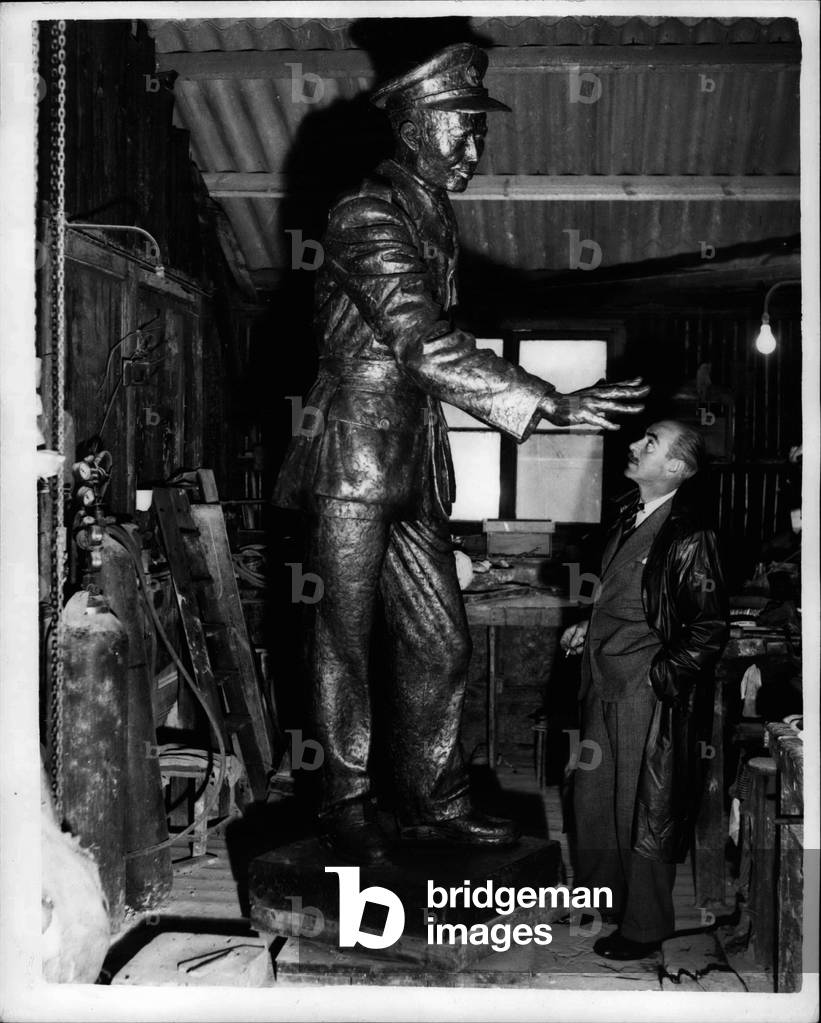 Nov. 21, 1953 - British Sculptor completes his bronze statue for ~ ~ ~ ~ ~ ~ ~ ~.: British Sculptor Bainbridge Copnall has just completed his Bronze statue of the late General U Aung San who was assassinated in 1947. The statue was commissioned by the Burma Government, and Mr. Copwall was assisted in the work by Burmese sculptor San Tei - who besides working on the statue donned a uniform and at times acted as model. The statue is 9 ft. high and is to be shipped to Burma next month to be erected in the center of Rangoon