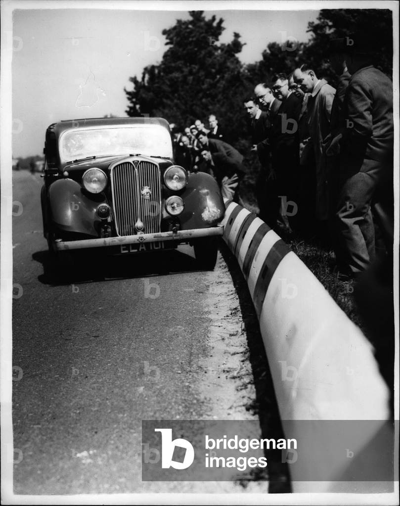 Jun 06, 1953 - Demonstrating The Dahl Safety Kerb New Road Device For Saving Life.. A demonstration was held this afternoon along a stretch of road two miles South of Bletchloy, beside the Grand Union Canal - of the” Dahl Safety Kerb” - which consists of white reinforce concrete section supported that on impact by a nearside front tyre the course of the vehicle is deflected along the direction of the” Kerb” producing a braking effect which onables the driver to regain control. The devices has for a long time been in use in Denmark, where it was invented - and has proved successful in Canada; France; Germany, Sweden, Switzerland U.S.A. etc