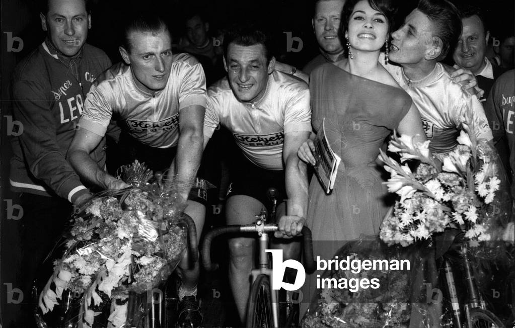 November 11, 1958 Michele Mercier welcoming cyclists Andre Darrigade, Ferdinando Teruzzi and Jacques Anquetil