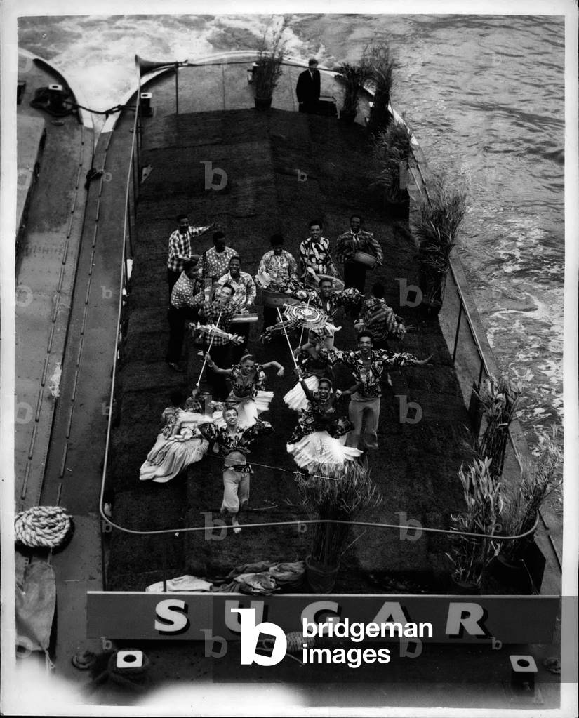 Jul 07, 1953 - Royal Coronation Pageant on the Thames... Looking down on 'Sugar'... Keystone Photo Shows: Looking down on the tables representing 'Sugar' - as seen from Hungerford Bridge during the Royal Coronation River Pageant on the Thames this afternoon.