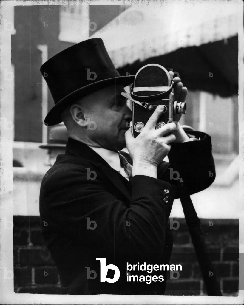 Tue 19, 1953 - Top-Hatted photographer: The wedding took place today at St. Paul's Knightsbridge, between Miss P.G. Ledingham, of Leeds, and Mr. Stephen Wildblood