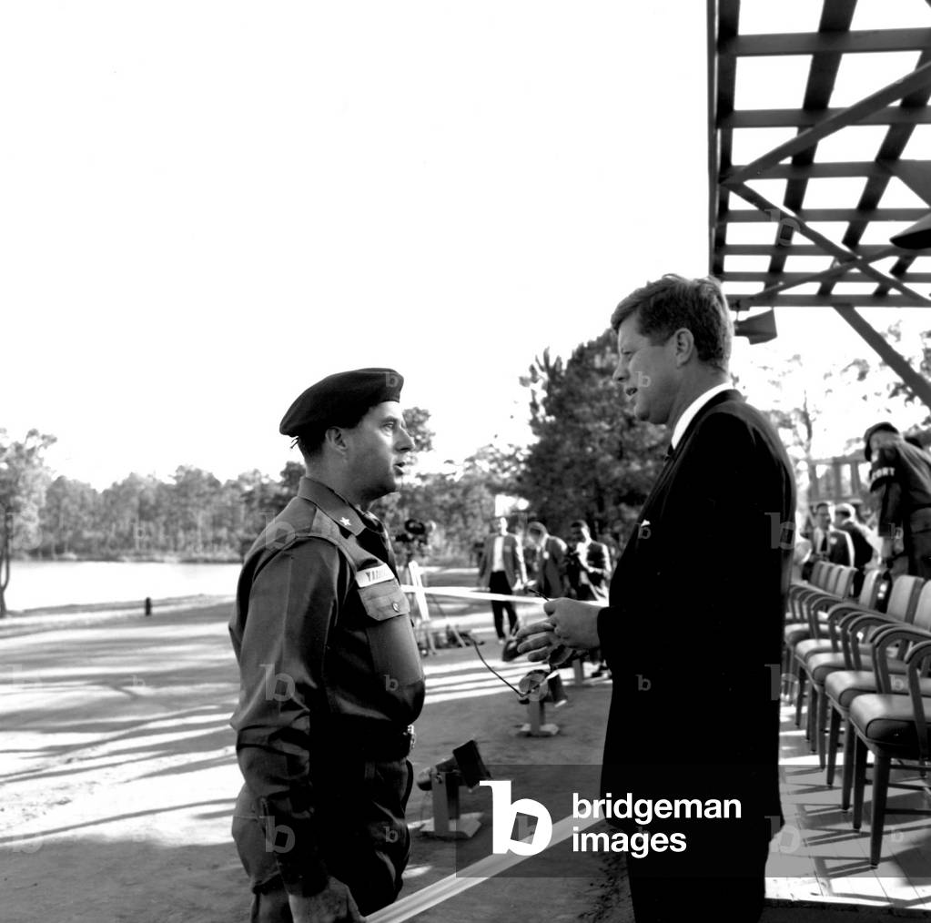 1961; Washington, DC, USA; President John F. Kennedy (1917-1963) talking with an officer