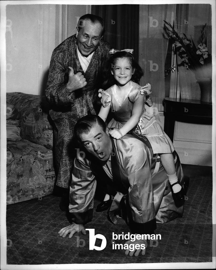 Jul 07, 1953 - Abbot and Costells in London. American comedianes for the Balladiue: Photo shows Bud Abbot thumbs a lift when Lou Costello - his partner gives a pick-a-back to his five year old daughter Christie at the Savoy Hotel.. The comedians are to appear at the London Palladium.