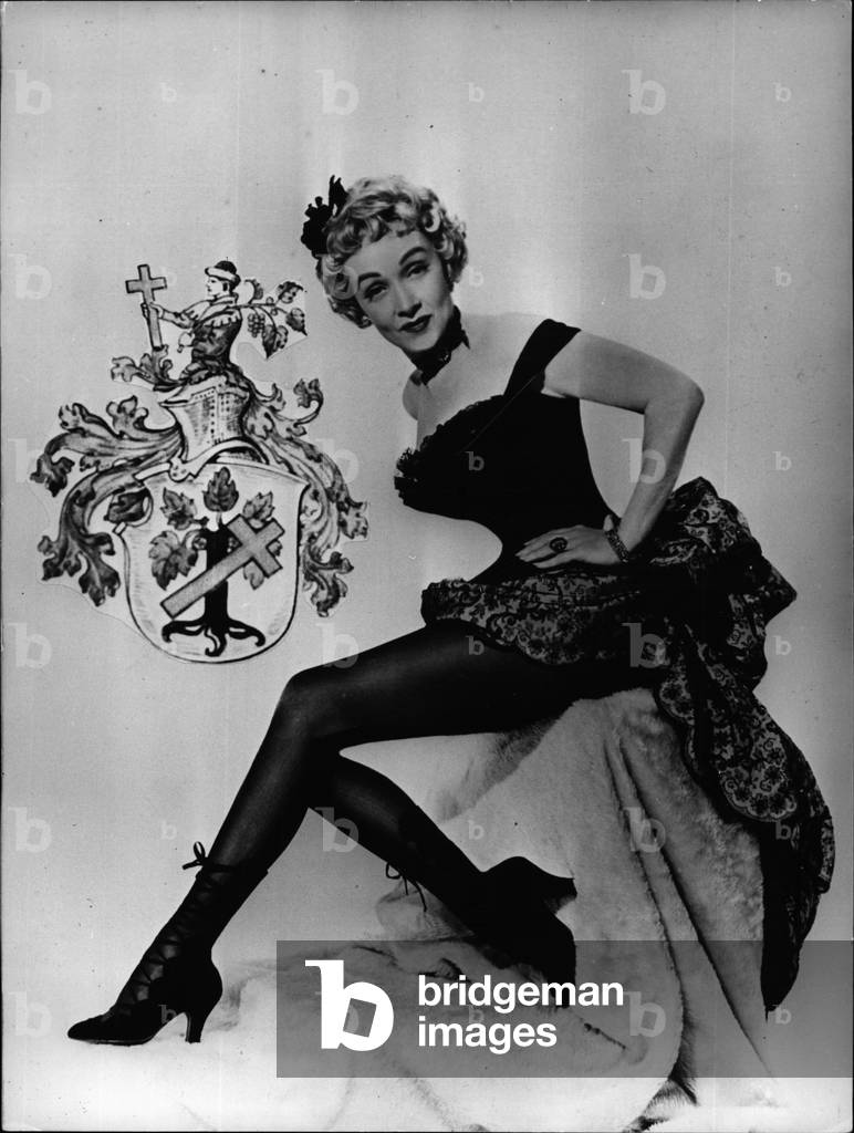 May 05, 1954 - Did you ever Know: That Marlene Dietrich, the “most charming grandy” of the world, has a house - weapon? Well, here in our picture you can have a look at. Marlene, in one of her latest picture, her” story - woven” legs an the weapon, the existence of which is rather unknown