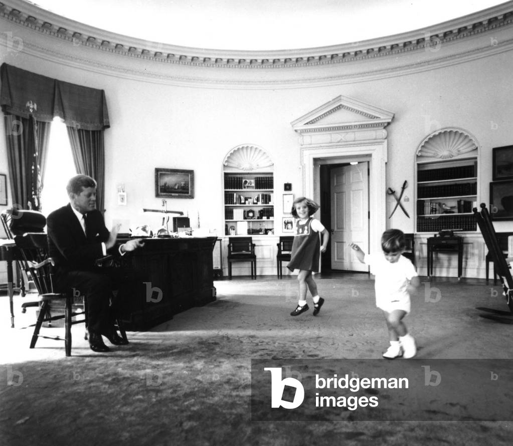 1960; Washington, DC, USA; President John F. Kennedy (1917-1963), CAROLINE KENNEDY & JOHN F.KENNEDY JR dancing in the Oval Office..