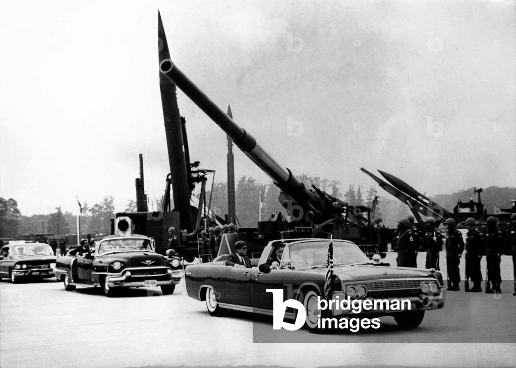 June 25, 1963 - Hanau, Germany - President JOHN F. KENNEDY troops the line of 15000 soldiers in his car during a troop inspection held at Fliegerhorst Kaserne in Hanau, Germany. This was the biggest troop demonstration held in Europe by the US Forces