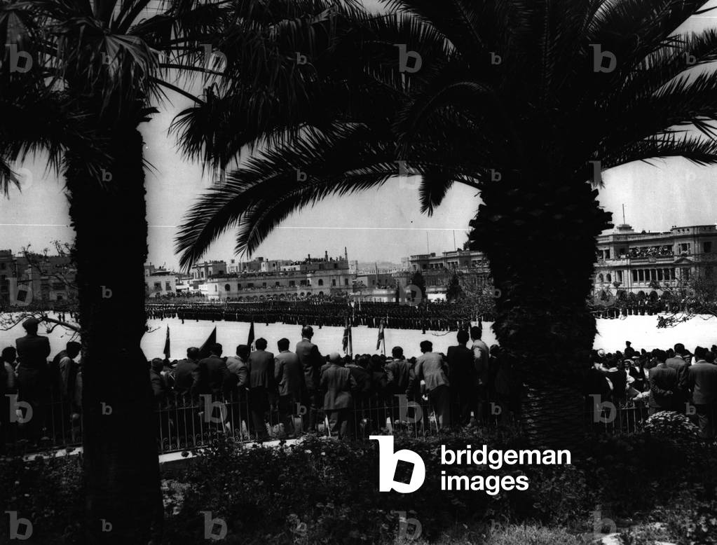 May 05, 1954 - Prince Charles and Princess Anne Watch Malta Parade.: Prince Charles and his Princess Anne went ashore at Malta today officially for the first time - when they watched their mother review the combined services at Floriana Parade Ground