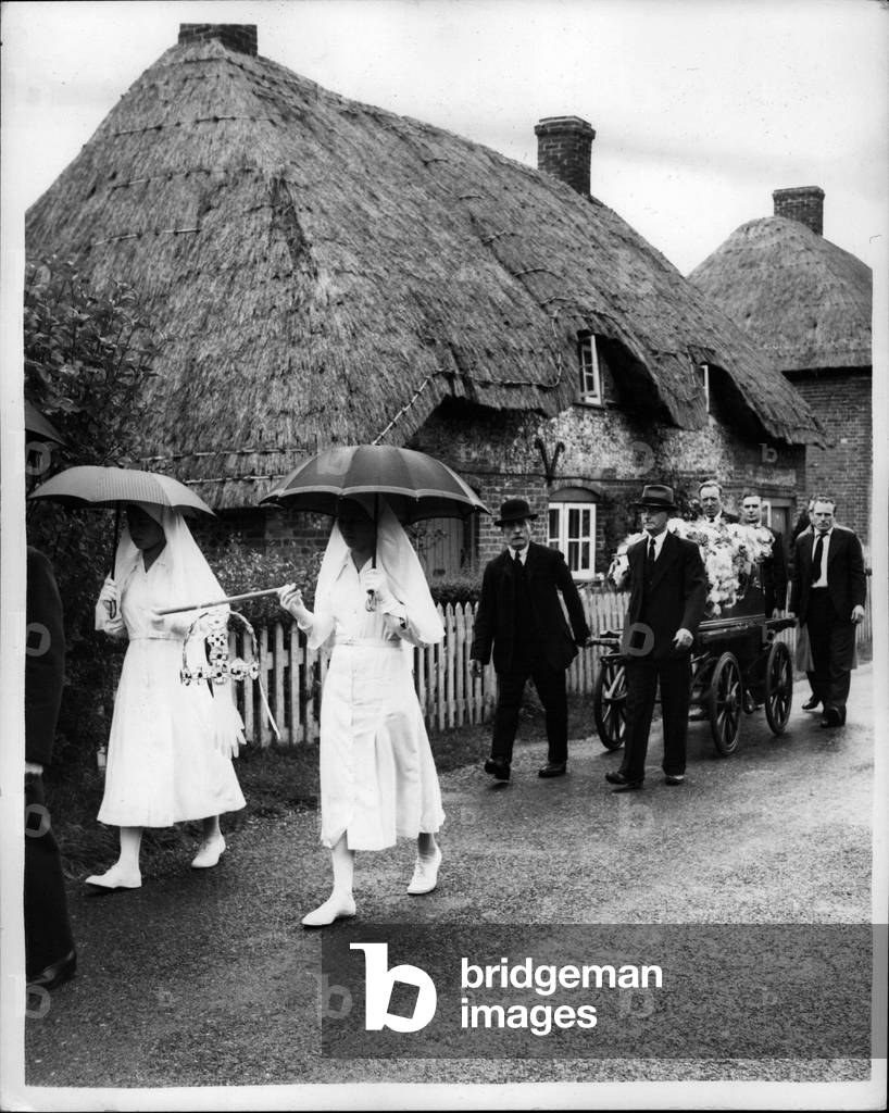 Sep. 09, 1953 -” Virgins Crown” Honor Revived At A Funeral: Theme diagonal costume of carrying a virgin's crown was carried out at a funeral at Abbott's Ann, near Andover, Hants, today for the first time in 32 years.It is the only place in England where the ceremony is still observed in England where the ceremony is still observed. Virginia's crown is awarded on the death of an un-married person of unblemished character who as born, baptized and confirmed in the parish, and was a communicant of the church there. the crown, made of hazel wood and parchment, is carried at the head of the coffin by two young Virginia of the parish. It is then placed on the front of th church for three weeks. If by tghe ned of that tome no one has challenged of disproved the dead person's right to the honor the crown is hung in the church until it decays. The funeral at which it was arranged to confer the honorary today was that of 72-year-old Miss Florence Jane Wisewell, of Little Ann