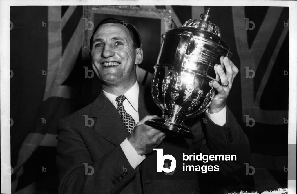 Tue 03, 1953 - Len Hutton Receives The” Sportsman Of The Year Trophy”: Len Hutton, Britain's No. 1 cricketer, who was elected” Sportsman of the Year” of 1952 in the national ballot organised by” Sporting Record”, was presented with the trophy by Lord Burghley at the Savoy Hotel this evening