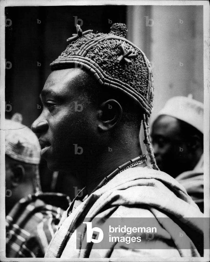 Jul. 07, 1953 - Nigerian Constitution Conference Opens.. The Nigerian Constitution Conference opened at 10. Carlton House Terrace. Keystone Photo Shows: - Nearest camera is the The Obi of Nwoko II - wearing a beaded cap - as he arrived for the conference.