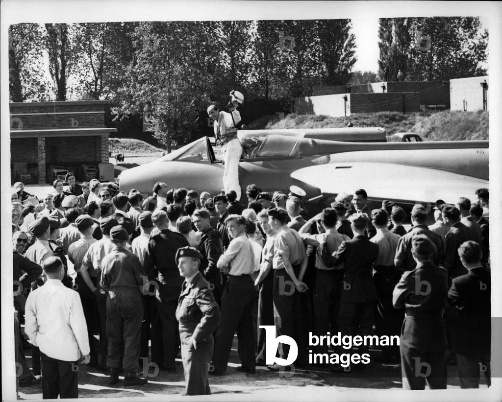 Sep. 09, 1953 -” 725” M.P.H.” SAIS NEVILLE DUKE AFTER WORLD'S AIR SPEED RECORD ATTY: Neville Duke made a new attempt on the world air speed this afternoon in his swept -wing Hawker hunter Jet Fighter. He made four runs over the course off the Sussex coast - then did three victory rolls over Tangmere RAF Station. Dukesaid afterwards” my average speed was about 725 m.p.h., although the official figures may be several miles either side of that”. A speed of 723 m.p.h. was necessary for a new record. Keystone Photo Shows: - General view at Tangmere R.A.F. station, shows Neville Duke waving to the crowd after his record attempt today.