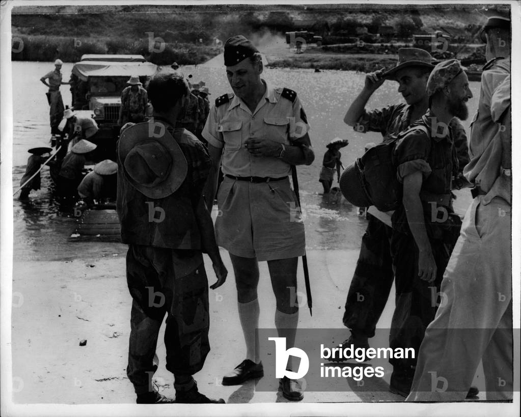 Jul 07, 1953 - The Indo China War Continues... The General Talks to War Correspondent... Keystone Photo Shows: The scene as General Cogny stops to talk to war correspondent Paul Corcuff - during a break in operations in the long drawn out Indo China war.