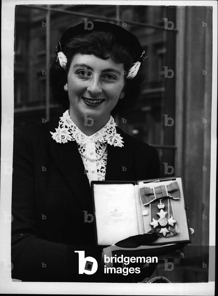 Jul 07, 1953 - World Champion Skating Star Receives The O.B.E.. Jeanette Altwegg Waiting Investiture.. Among the visitors to Buckingham Palace to receives their awards - was Miss Jeanette Altwegg the famous Britain and World Amateur Ice Skating Champion.. She received the Most Excellent Order of the British Empire.. Keystone Photo Shows: - Jeanette Altwegg displays her medal - after the presentation at Buckingham Palace.