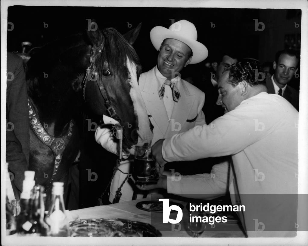 Jul 07, 1953 -” Champion” goes to the Press reception... and gets a drink: Cowboy screen star Gene Autry took his horse” Champion” with him when he went to the press reception held in his honour at the Savoy Hotel this evening