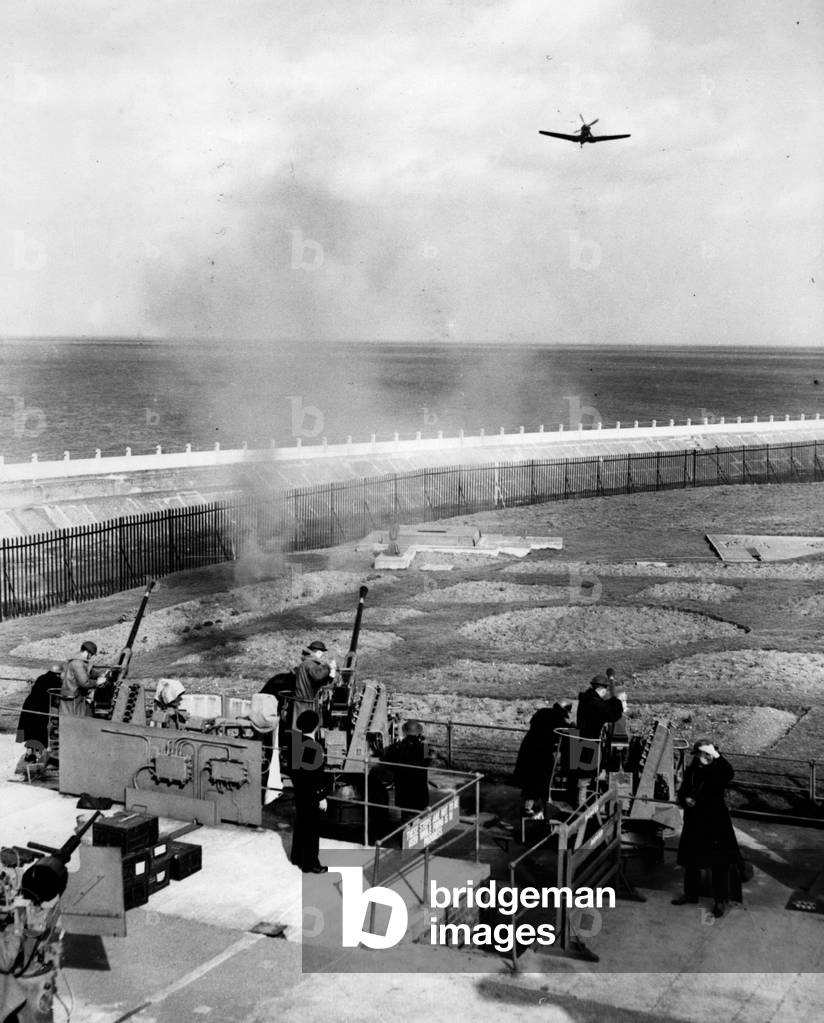 Tue 03, 1953 - The practical gunnery part of the Merchant Navy Defence courses, at Sheerness, Barton's Point: some merchant Navy men learn to fire guns against an” attacking” Spitfire