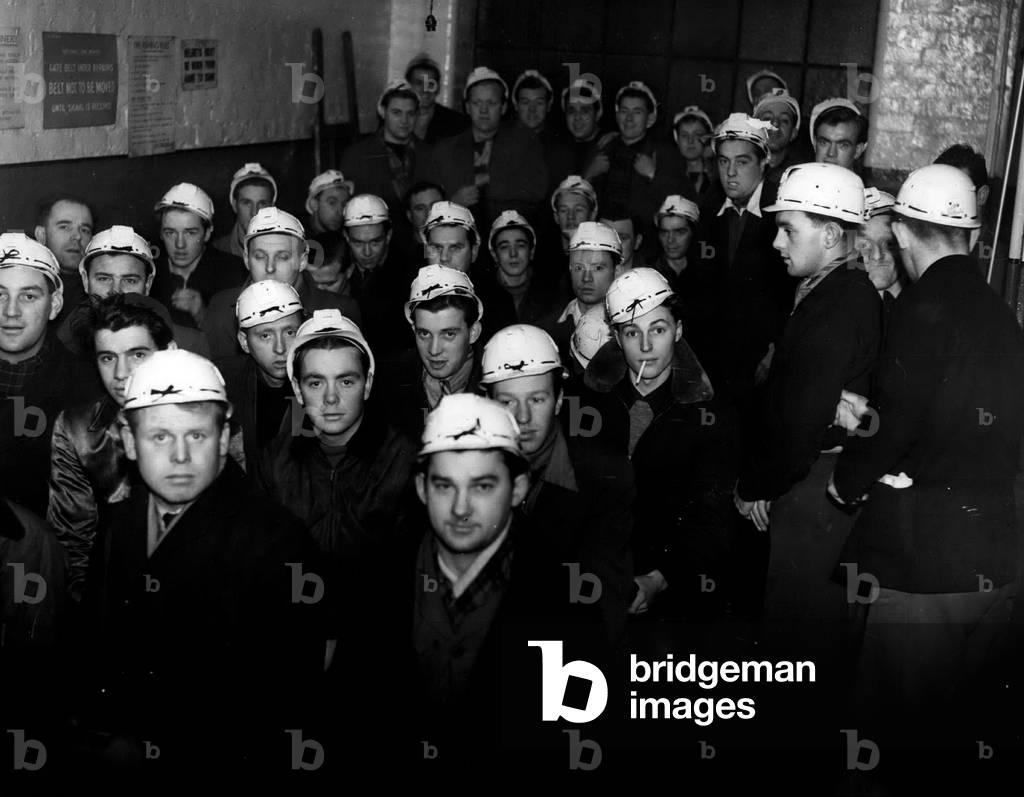 Jan. 01, 1955 - MERCHANT SEAMEN TAKE TO MINING. The National Coal Board have recruited coming miners from among dis-satisfield merchant seamen at Liverpool. The men, who total about 60, from Liverpool and Merseyside, started their training this week at the Sandhold Training Centre, Walkden. The are brought to the Centre by bus in the morning and taken back in the afternoon. All this week they get film shows and instructions on safety. KEYSTONE PHOTO SHOWS: - Some of the seamen, in mining helmets - seen in class at the Sandhole Training Centre