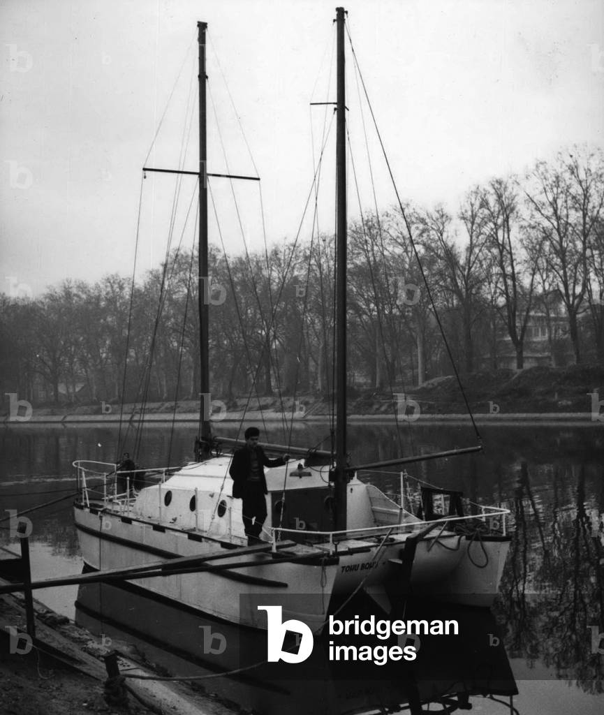 Dec. 12, 1953 - Four Men on a Boat.: The” Toh Bohu” a six ton sailing boat moored at Maison-Alfort, near Paris. Im on Christmas day four young Parisians, Claude Genet, Alain Peyratout, Claude Thyri and Jean Moinet sailed on it on the first lap of their trip round the world