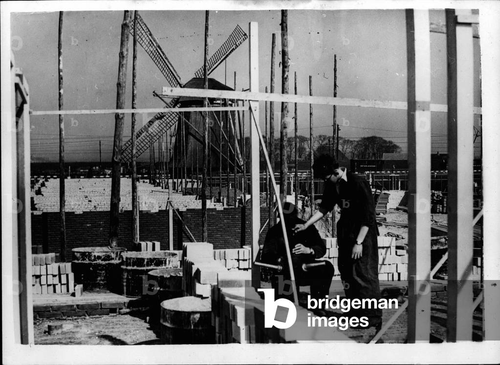 Tue 03, 1953 - The Vanishing Windmills of Amsterdam. Houses ~ ~ ~ ng the Sights.: Holland - the land of the Windmills is rapidly changing - for many of her windmills are vanishing from the eye - for many houses are being built in the vicinity of the windmills which are being hidden from view