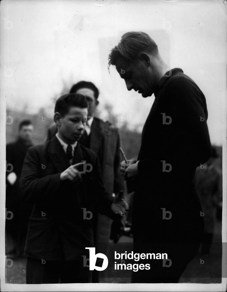Nov. 24, 1953 - 24-11-53 Hungarian footballers in training. Lorant signs autographs - Members of the Hungarian Football Team which meets England at Wembley tomorrow were to be seen training at the Fulham Ground this morning. Keystone Photo Shows: Lorant, a member of the Hungarian team signs autographs at the Fulham ground this morning.