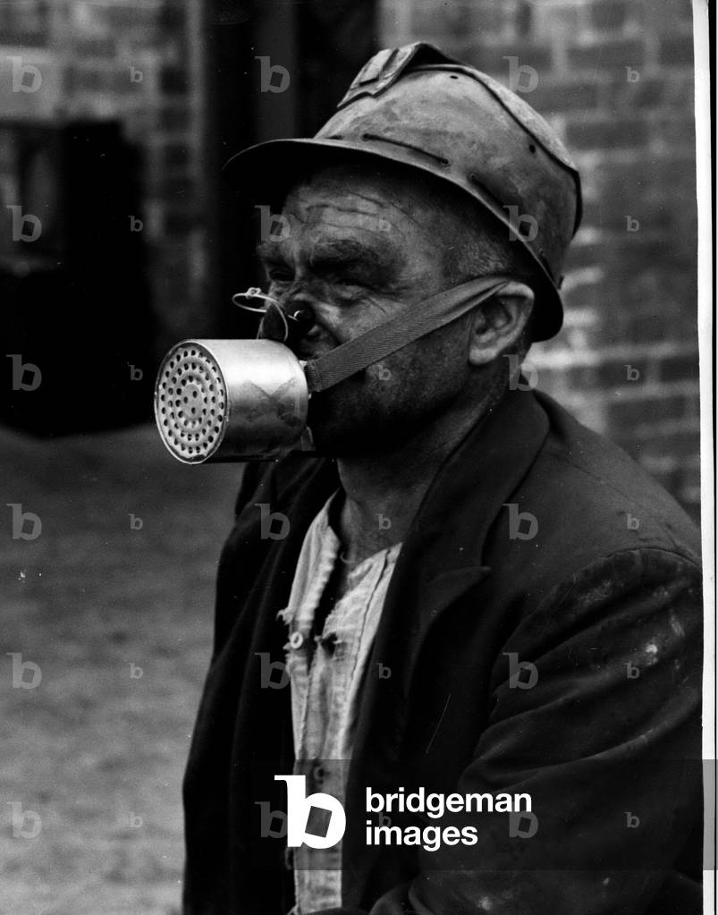 June 16, 1953 -” ~” For Miners under test. Men Portable Gas-Mask: A new type of” self-resouer” is to tried out at seveb Gollieries throughout the country and miners will report their reactions to the resouers end m ~ suggestions as to improvements etc. The” self-resouer” is a mask which weighs 11/2 lbs. and is held in place by streps to the back of the head and a rubber flap is gripped by the teeth . A Grip prevents the wearer from breathing through the nose. They will be carreid by the Miners for use in an emergency at such times a following an explosion when Carbon Monoxide gas is present