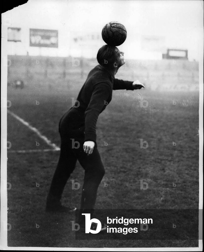 Nov. 24, 1953 - Hungarian Footballers IN Training.. Lorant Does A Balancing Act.. Members of the Hungarian Football Team which meets England at Wembley tomorrow were to be seen training at the Fulham Ground this morning