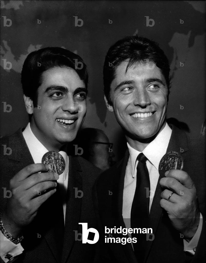 Apr. 04, 1966 - Enrico Macias (Left) And Sacha Distel Showing Their Medals, Awarded Prizes By Distributed By The Society Of Authors, Composers And Music Publishers
