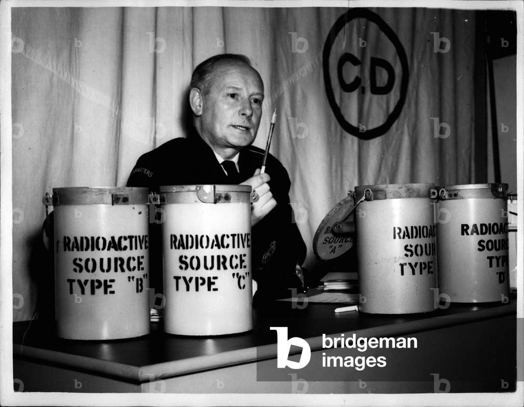 Jan. 01, 1954 - London's Atom Fortress is ready Vital Centre prepares for emergency - in Southwark.: The new Atomb Bomb proof fortress - one of 100 'atomic' C.D. headquarters in London is now ready for use in Southwark. At least a thousand tons of earth had to be moved for the construction of the centre. A diesel generator pumps filtered air into an “operations room” and provides emergency heat and light. Nothing should budge the control centre which has an area below ground level of over 2,000 square feet with its own telephone exchange, mess facilities; toilets and rest rooms for weary rescue teams. The fortress has been equipped with a recreation centre. In charge is Mr. Hugh Pierce who has moved into new prefab offices and training centre built on top the underground centre - and in case of emergency the teams move below to continue emergency operations unhampered