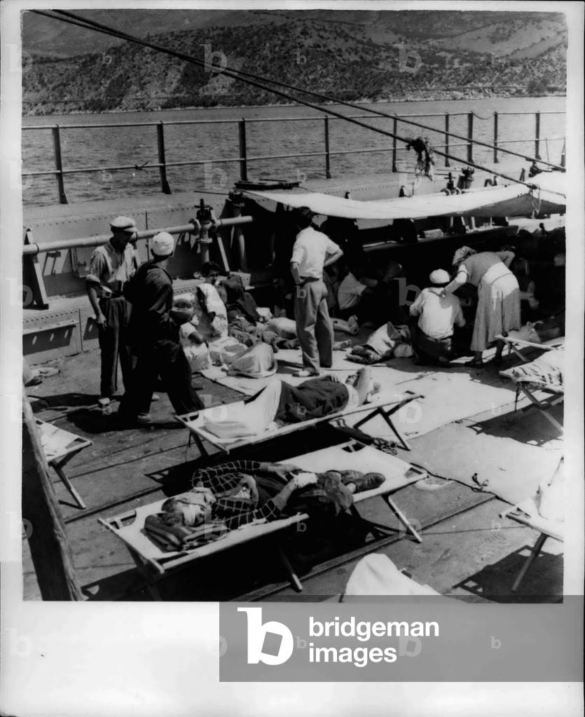 Aug. 08, 1953 - Greek Earthquake Disaster: Six days after the first shocks, Argostoli capitol of the Greek earthquake island of Cephalonia, is still burning. Latest figures are that 1,000 people have been killed, 4,000 injured and 10,000 made homeless
