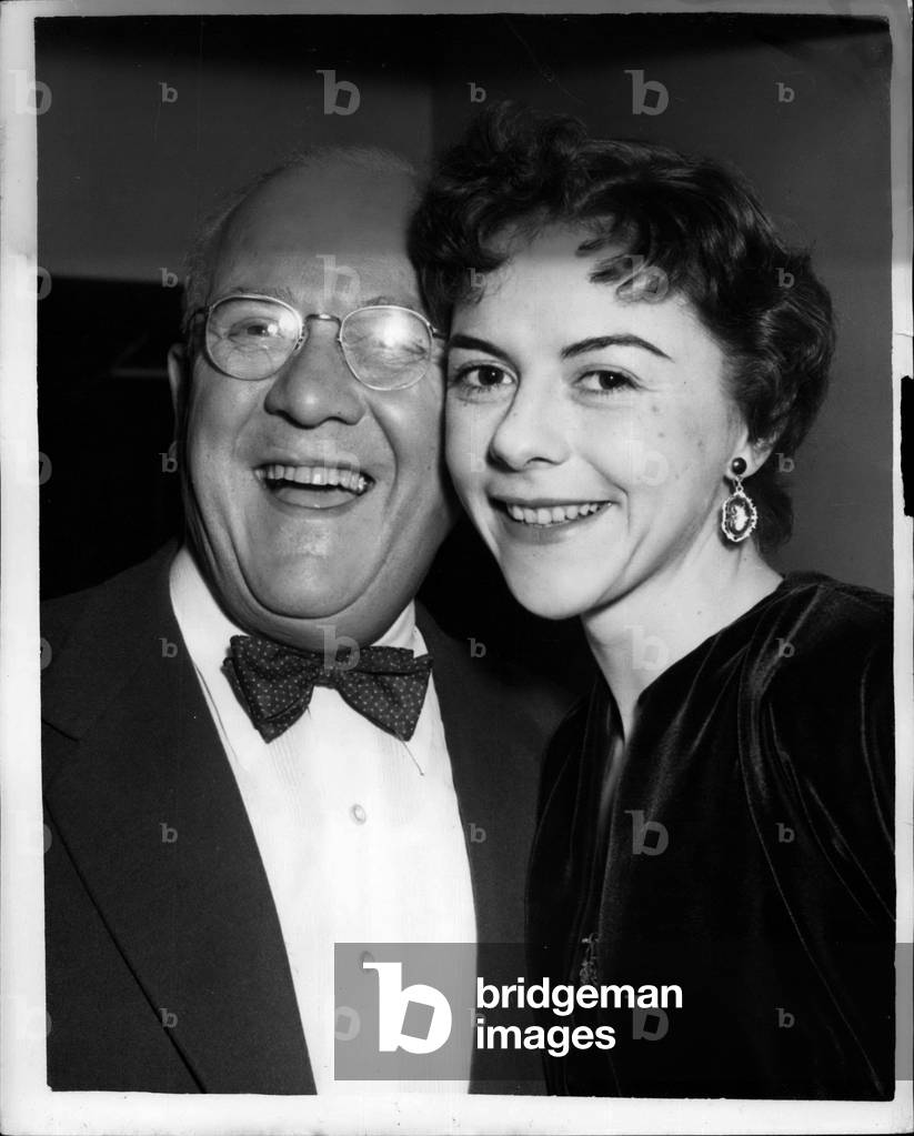Feb. 04, 1954 -” Actress of Year” - And” Showman of Year” Honour At Variety Club Luncheon. Miss Dorothy Tutin, whose performance in Graham Greene's” The Living Room” made her the talk of the entertainment world, and Mr. Jack Hylton, the impresario, were honoured by the Variety Club as the” Actress of the Year” and the” Showman of the Year” respectively at a special testimonial luncheon held at the Savoy Hotel today. Miss Tutin was presented by Dame Sybil Thorndike with a scroll on which are recorded extracts from reviews on her performance in “The Living Room” by London critics. Each extract credits the newspaper in which it appeared and is signed by its author-critic. The choice of Miss Tutin is that of the London critics themselves, as is that Mr. Jack Hylton, to whom an inscribed scroll was presented by Sir Malcolm Sargent. Keystone Photo Shows: - Miss Dorothy Tutin and Mr. Jack Hylton, photographed at the luncheon today