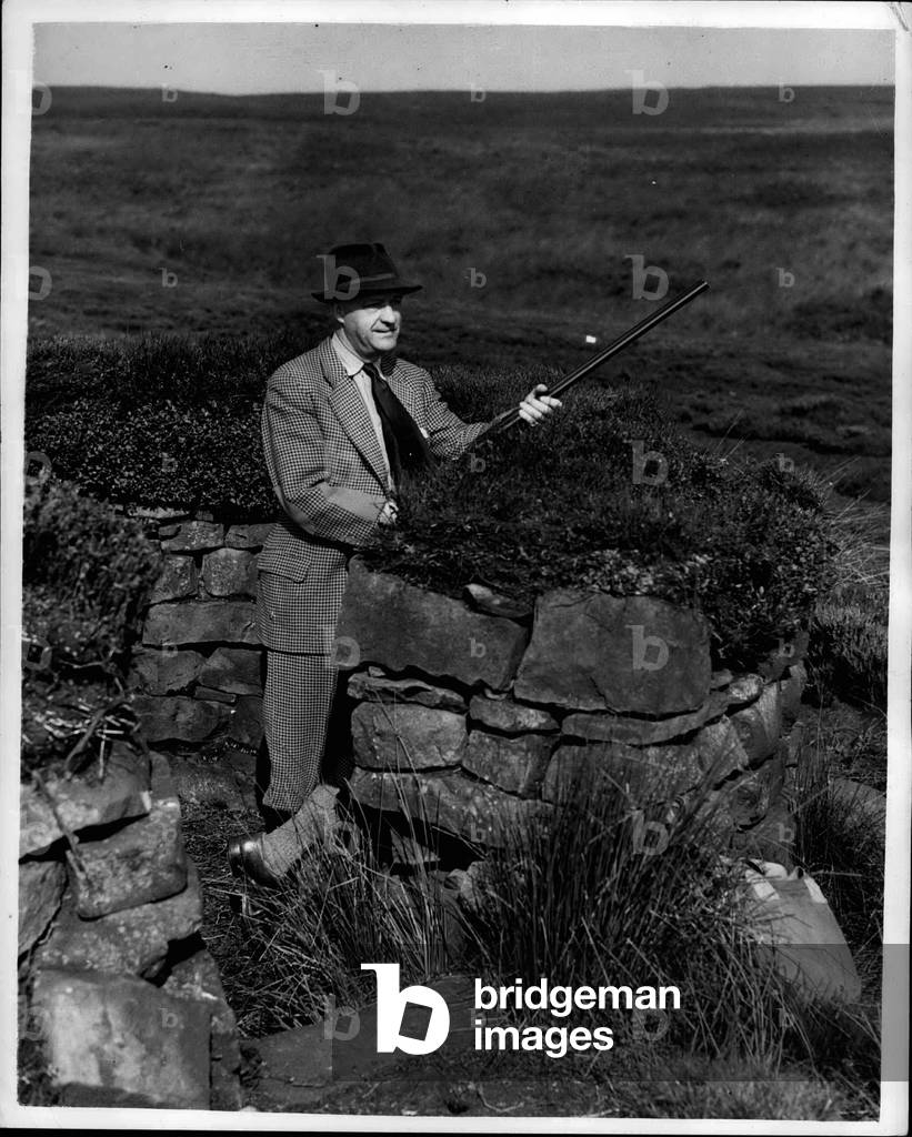 Aug. 08, 1953 - Chancellor At The Butts; Mr. R.A. Butler, the Chancellor of the ezchaquer, who is on holiday, smiles as he waits for the birds to rise. He is at the butts on the moors at Ma sham, Yorkshire, where, yesterday he was a member of Viscount Swinton's grouse shooting party on” The Glorious Twelfth '
