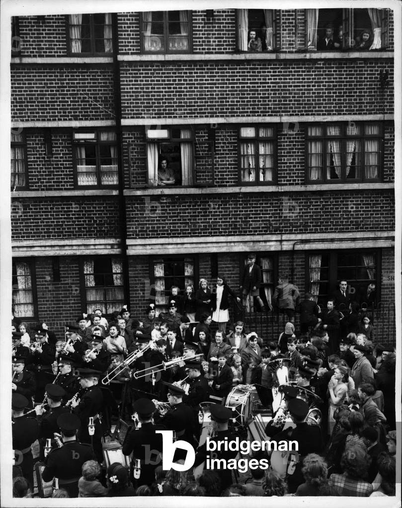 May 04, 1953 - Band turns out for Prisoner Hero. The band of the Royal Fusiliers and a contingmert of men, went to the Arnold Estate, Druid Road, Bermondaey, to pay an official welcome, attended by the Lady Mayoress of Bermondsey, to Private George Hodkinson, D.C.M., one of the prisoners released by the Communists