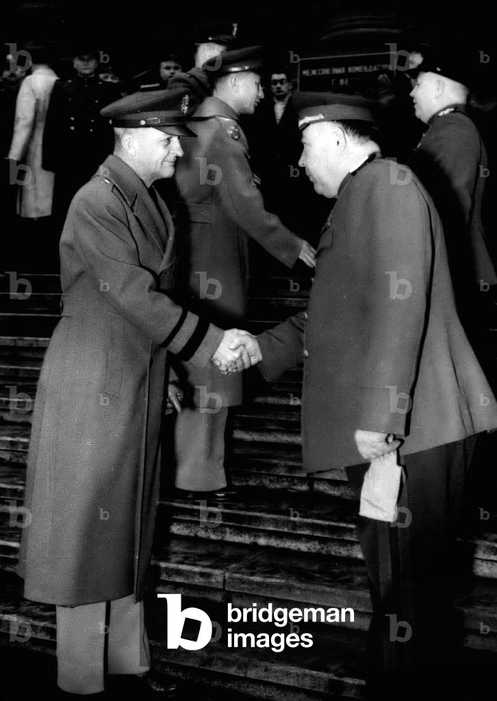 Jan. 01, 1955 - American And Soviet Commanders Shake Hands In Vienna.. New Year Guard Change Ceremony: American and Russian Guard Commanders were to the seen shaking hands in front of the Interllied Headquarters (Vienna's Palace of Justice) during the New Year's even ceremony of Changing the Guard - when the American Forces relieved the Soviet Guard for the month of January