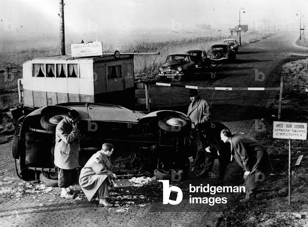 Jan. 01, 1955 - He Comes a Cropper at Amsterdam's First” Anti Skid” School... This driver came a cropper - when he tried to take a bend to fast - at the first Anti Skid School of Amsterdam - which has just been started in the City - to emulate the famous London Transport skid school for transport drivers
