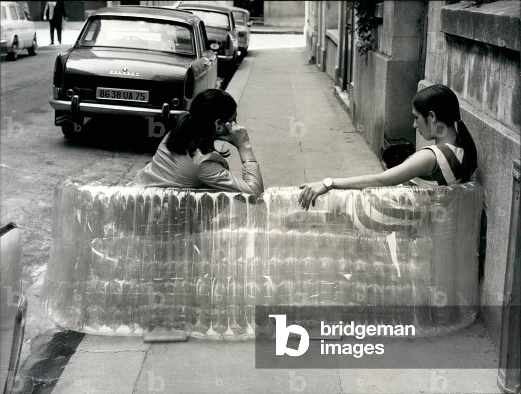 The latest: A Sofa Of Air With A Transport Inflatable Cover Of Plastic, Emmanuelle Khanh and her sister trying out the new sofa, Paris, 1962 (b/w photo)