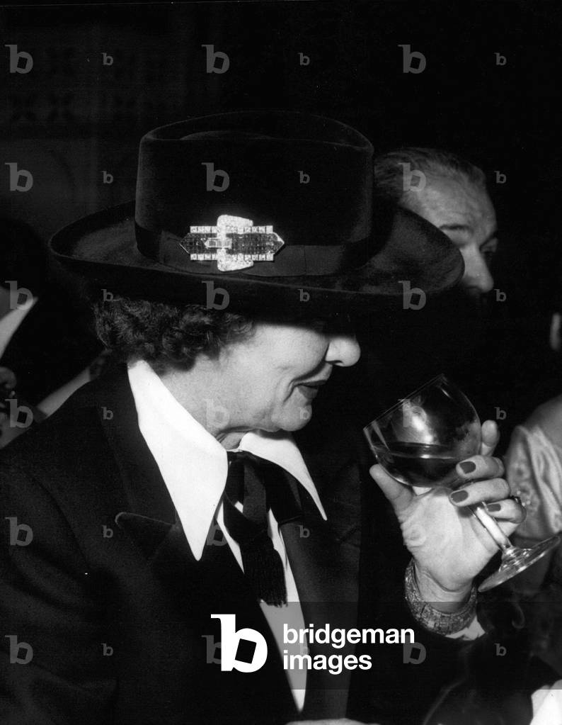 Dec. 22, 1954 - La Mome Moineau (Lucienne Suzanne Dhotelle, 1908-1968) Wearing a Smoking Jacket and Sombrero