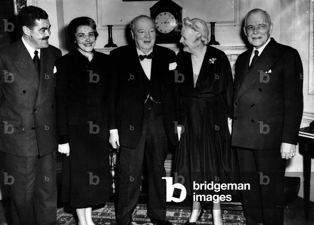 Feb. 06, 1954 - Canadian Premier Lunches with Sir Winston Churchill: British Prime Minister, Sir Winston Churchill with his guests, Canadian Prime Minister Mr.Louis St. Laurent, and members of his family at No. 10, Downing Street, London today. (Left to Right): Mr. Jean Paul St.Laurent, son of the Canadian Premier; Mrs. Hugh O'Donnell, daughter of Mr. Louis St. Laurent; Sir Winston Churchill; Lady Churchill and Mr: Louis St. Laurent. The Canadian Premier is in London on a world tour to meet leaders in the search for an approach to peace