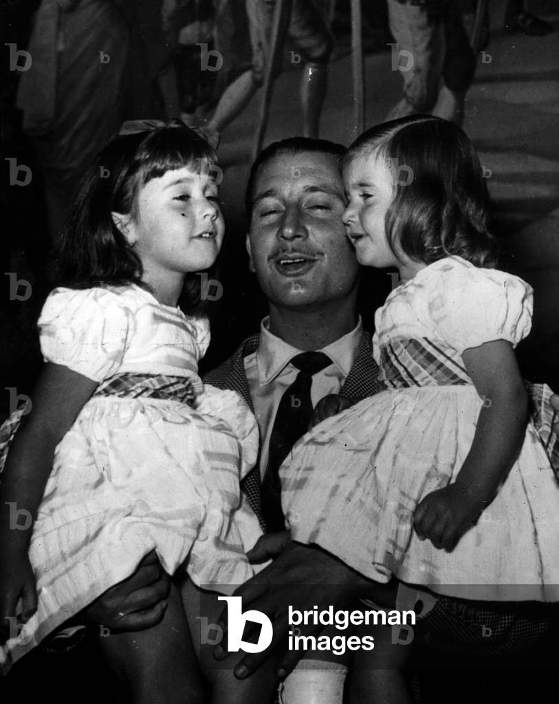 Sep. 27, 1954 - 27-9-54 The granddaughters of General Franco greet their father - The Marquis of Villaverde, son-in-law to General Franco, the dictator of Spain, was greeted by his two daughters when he returned to Madrid recently after a stay in the United States where he was studying surgery. Keystone Photo Shows: The Marquis of Villaverde is greeted by his two daughters, Mariz Del Carmen (left) and Marie de la O on his arrival to Madrid