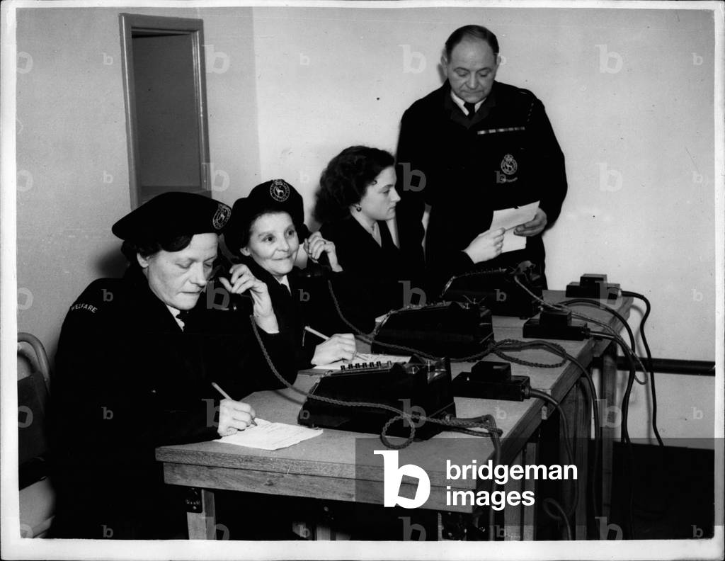 Jan. 01, 1954 - London's Atom Fortress Is Ready Vital Centre Prepared For Emergency - In Southwark: The new Atom Bomb Proof fortress one of 100 'atomic' C.D. headquarters in London is now ready for use in Southwark. AT least a thousand tons of earth has to be moved for pumps for the construction of the centre. A diesel generator pumps filtered air into an “operations room” and provides emergency heat and light. Nothing should budge the control center which has an area below ground level of over 2,000 square feet with its own telephone exchange, mass facilities; toilets and rest rooms for weary rescue teams. The fortress has been equipped with a recreation centre. In changer is Mr. Hugh Pierce who has moved into new prefab offices and training center built on top of the underground centre - and in case of emergency the teams move below to continue emergency operations unhampered