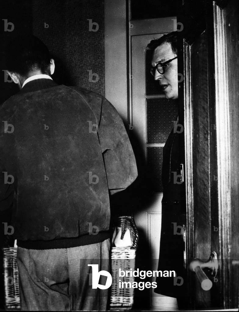 Sep. 18, 1953 - Maclean Mystery: Mr. Scheers, brother-in-law of Mrs. Maclean, who refused to be interviewed, opens the door cautiously to take a food basket sent by a near-by restaurant. Mr. Scheers is staying with Mrs. Dunbar, Mrs, Maclean's mother, at Geneva.