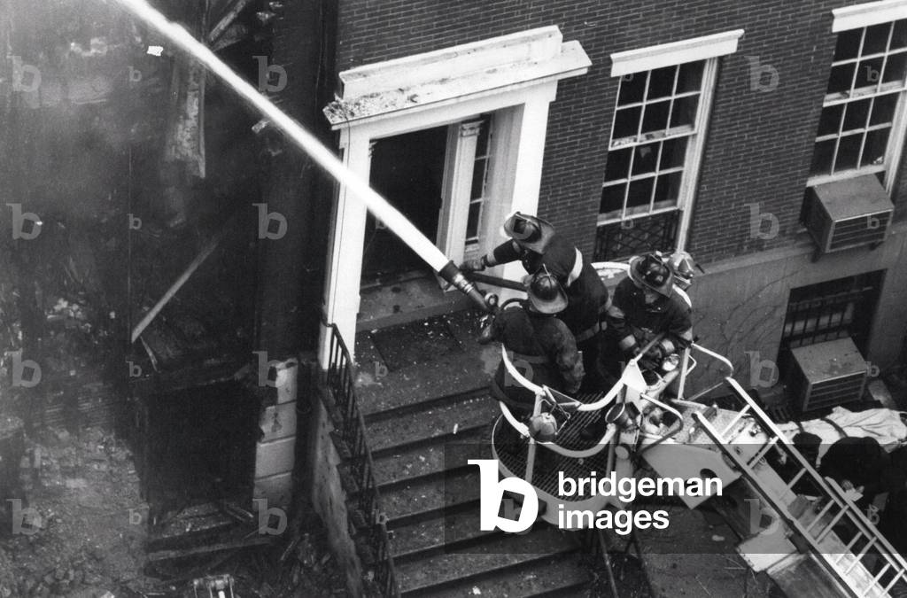 New Left, student activism and attacks: explosion and fire in a house in Greenwich Village, New York. Members of the radical movement SDS (Students for a Democratic Society) were seen fleeing the explosion. March 3, 1970 - Tue 03, 1970 - Explosions and Fire Destroy Greenwich Village House - Several People Are Dead. Today at noon three explosions and a raging fire destroyed a £275,000 townhouse at 18 West 11 Street in New York's Greenwich Village. Experts say the accident originated from a bomb factory, which could have destroyed the entire block. Following the explosion Cathlyn Wilkerson, daughter of the house owner, a member of the student radical SDS Movement was seen fleeing with other young people, their clothes obviously damaged by the explosion. Police identified the body of Theodore Gold, a student SDS leader and” Weathermen” member at Columbia University. It is known that he was working on a manuscript on revolution.